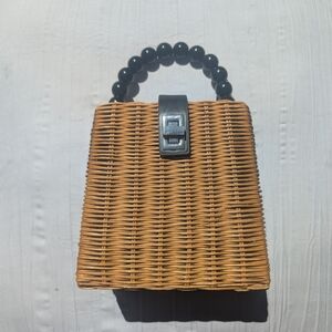 Elegant Tan Wicker Handbag with Black Accents